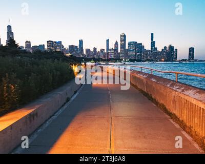 the Chicago city skyline seen one evening from the Lakefront Trail Stock Photo