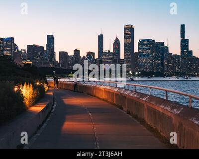 the Chicago city skyline seen one evening from the Lakefront Trail Stock Photo