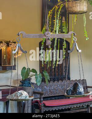 Guatemala, La Antigua - July 20, 2023: Jade Maya Museum. Scale with 2 different Jade rocks Stock Photo