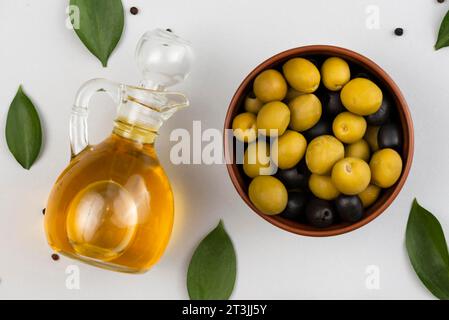 Bowl with olives olives oil bottle Stock Photo