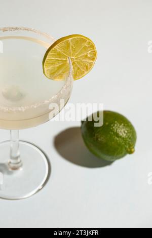 Homemade classic margarita drink with lime salt white background Stock Photo