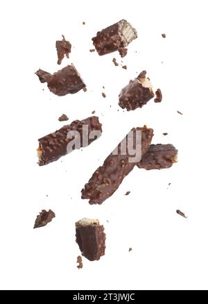 Pieces of tasty chocolate bars falling on white background Stock Photo