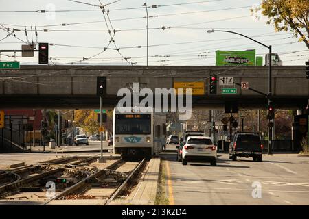 San Jose, California, USA - November 17, 2021: Afternoon sunlight shines on a VTA Valley Transportation Authority light rail train. Stock Photo