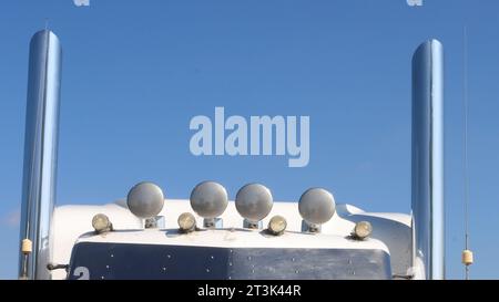 Semi truck stacks fram blue sky for print. Cab top with lights.   Concept trucking and long haul diesel. Stock Photo