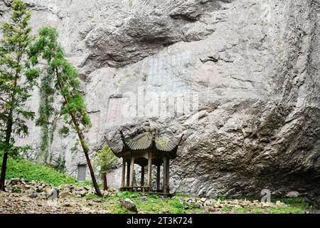 Photo of a traditional Chinese style pavilion under the cliff, Zhejiang Province, China, Stock Photo