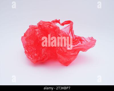 red plastic bag trash isolated on white Stock Photo