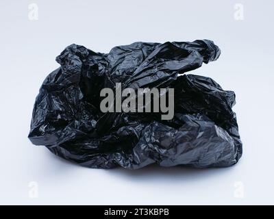 black plastic bag trash isolated on white Stock Photo