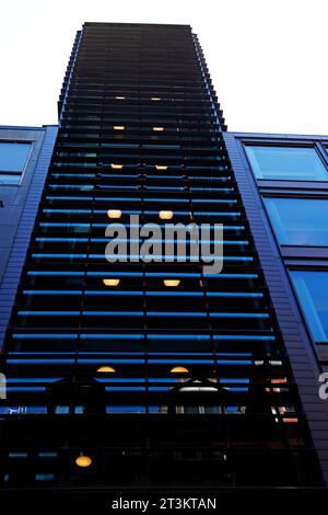 Stockholm, Sweden - May 23, 2023: tall building with blinds on the outside to protect from the sun Stock Photo