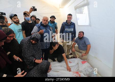 Al-Jazeera correspondent Wael Al-Dahdouh mourns over the bodies his three children who were killed along with his wife Al-Jazeera correspondent Wael Al-Dahdouh mourns over the bodies his three children who were killed along with his wife and some Relaives in an Israeli strike in the Nuseirat camp, at Al-Aqsa hospital in Deir Al-Balah on the southern Gaza Strip, on Ocober 26, 2023. Thousands of Palestinian civilians, have died since October 7, 2023, after Palestinian Hamas militants based in the Gaza Strip entered southern Israel in an unprecedented attack triggering a war declared by Israel on Stock Photo