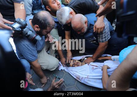 Al-Jazeera correspondent Wael Al-Dahdouh mourns over the bodies his three children who were killed along with his wife Al-Jazeera correspondent Wael Al-Dahdouh mourns over the bodies his three children who were killed along with his wife and some Relaives in an Israeli strike in the Nuseirat camp, at Al-Aqsa hospital in Deir Al-Balah on the southern Gaza Strip, on Ocober 26, 2023. Thousands of Palestinian civilians, have died since October 7, 2023, after Palestinian Hamas militants based in the Gaza Strip entered southern Israel in an unprecedented attack triggering a war declared by Israel on Stock Photo