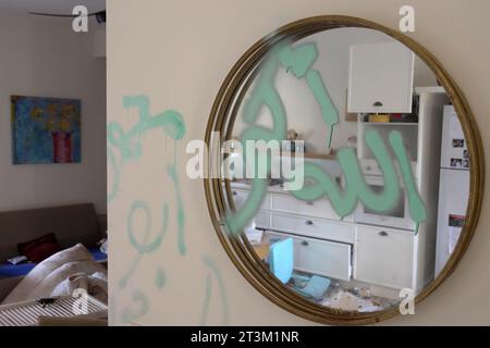 Writing in Arabic which reads ' Alla Hu Akbar' left by Palestinian militants smeared in a mirror inside a house during the October 7 attack by Palestinian Hamas militants in kibbutz Beeri near the border with Gaza stands on October 17, 2023 in Be'eri, Israel. In the wake of the Oct. 7 attacks by Hamas that left 1,400 dead and 200 kidnapped, Israel launched a sustained bombardment of the Gaza Strip and threatened a ground invasion to vanquish the militant group that governs the Palestinian territory. Stock Photo