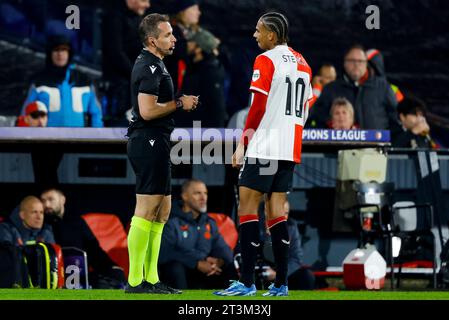 ROTTERDAM, NETHERLANDS - OCTOBER 25: referee Tobias Stieler and Calvin Stengs (Feyenoord Rotterdam) during the Group E - UEFA Champions League 2023/24 Stock Photo