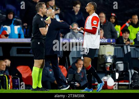 ROTTERDAM, NETHERLANDS - OCTOBER 25: referee Tobias Stieler and Calvin Stengs (Feyenoord Rotterdam) during the Group E - UEFA Champions League 2023/24 Stock Photo