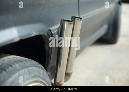 Sports car exhaust pipe. Details of sports car. Exhaust pipes. Transport details. Stock Photo