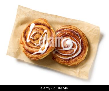 freshly baked cinnamon rolls isolated on white background, top view Stock Photo