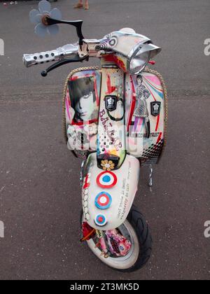 A Mod scooter parked up on the seafront at Brighton Stock Photo