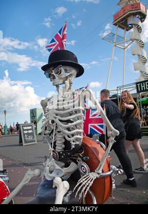 A skeletal figure on a scooter in Brighton Stock Photo