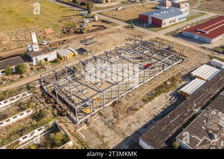 Steel frame structure. Construction of warehouse from metal structures. Aerial view Stock Photo