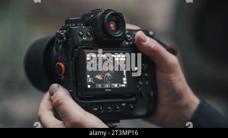 male hands holding camera Stock Photo