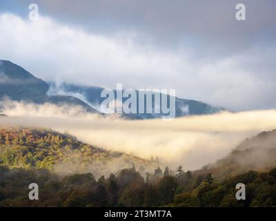 Cloud and mist around Wetherlam from Ambleside, Lake District, UK. Stock Photo