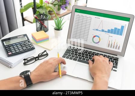 Analyzing data for marketing plan. Business analytics, spreadsheet app on laptop Stock Photo