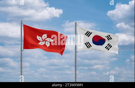 South Korea or Republic of Korea or ROK and Hong Kong flags waving together in the wind on blue cloudy sky, two country relationship concept Stock Photo