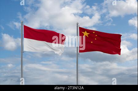 China and Indonesia and Bali flags waving together on blue cloudy sky, two country relationship concept Stock Photo