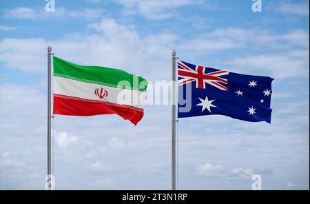Australia and Iran flags waving together on blue cloudy sky, two country relationship concept Stock Photo