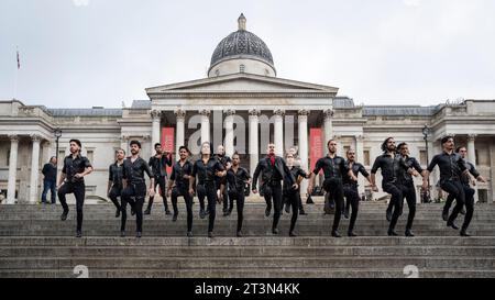 London, UK.  26 October 2023.  The all-male dance troupe called Malevo performs at a photocall in Trafalgar Square.  They combine traditional Argentinian dance (Malambo) with elements of flamenco and drumming, including the use of boleadoras (a leather and stone hunting tool used by Gauchos), pounding movements, energetic stomping (zapateados) and lightning footwork (cepillados).  Malevo will be performing at the Peacock Theatre 31 October to 4 November.   Credit: Stephen Chung / EMPICS / Alamy Live News Stock Photo