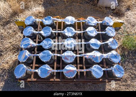 A battery of launchers for 4' pyrotechnic shells being prepared for a fireworks show in a field in Utah. Stock Photo