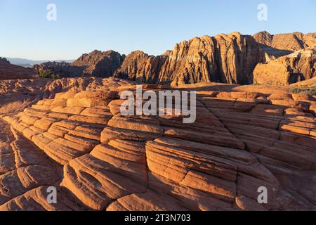 First light on the eroded Navajo sandstone formations on the Petrified Dunes Trail in Snow Canyon State Park in Utah. Stock Photo