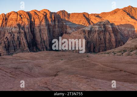 First light on the eroded Navajo sandstone formations on the Petrified Dunes Trail in Snow Canyon State Park in Utah. Stock Photo