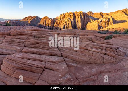 First light on the eroded Navajo sandstone formations on the Petrified Dunes Trail in Snow Canyon State Park in Utah. Stock Photo