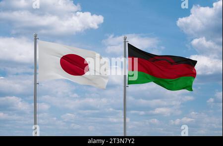 Malawi and Japan flags waving together on blue cloudy sky, two country relationship concept Stock Photo