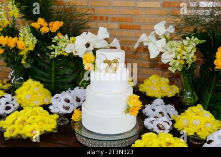 detail of the number seventy on the top of the birthday cake, 70 birthday, white cake, 70 year old birthday cake candle Stock Photo