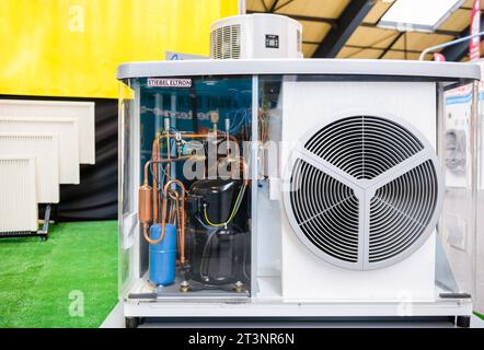 Paris, France - Mar 28, 2015: A Stiebel Eltron heat pump featuring a transparent glass surface, revealing the inverter and its accompanying accessories, highlighting its sophisticated design and intricate components Stock Photo
