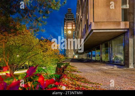 Ithaca, New York, US - October 25, 2023: Night photo of McGraw clock tower with construction scaffolding, landmark at Cornell University, and iconic p Stock Photo