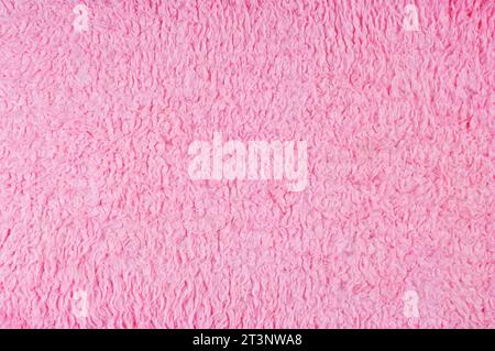 Full frame image of a pink woollen rug - John Gollop Stock Photo