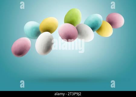 Colorful easter eggs floating on blue background. Stock Photo