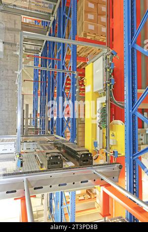 Automated Storage and Retrieval System Shuttle Robot Forks in Fulfillment Warehouse Stock Photo