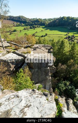 Cratcliffe Tor a rock outcrop near Robin Hoods Stride and the village ...