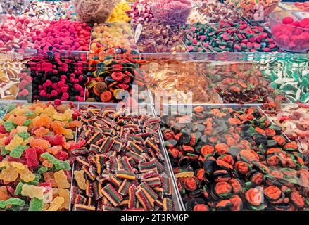 A selection of colourful sweets on sale at a market stall in Polignano a Mare, Italy. Stock Photo