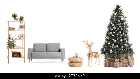 Christmas tree with gifts, stylish grey sofa, bookcase, wicker ottomans and wooden reindeer on white background Stock Photo