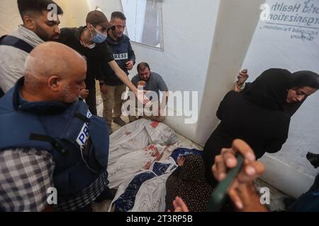 Gaza, Palestine. 26th Oct, 2023. (EDITOR'S NOTE: Image depicts death) Al-Jazeera correspondent Wael Al-Dahdouh pray on his family who was killed along with his wife the day before in an Israeli strike on the Nuseirat camp. Thousands of civilians, both Palestinians and Israelis, have died since October 7, 2023, after Palestinian Hamas militants based in the Gaza Strip entered southern Israel in an unprecedented attack triggering a war declared by Israel on Hamas with retaliatory bombings on Gaza. (Photo by Ahmed Zakot/SOPA Images/Sipa USA) Credit: Sipa USA/Alamy Live News Stock Photo