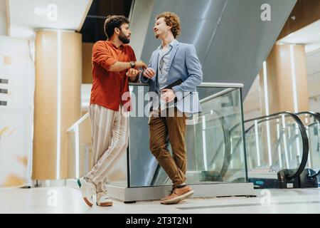 Architects and engineers discuss project planning, sustainable design and profitability. Corporate partners strategize for innovative infrastructure. Stock Photo
