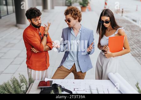 Corporate Development: Architects and Engineers Discussing Sustainable Design and Profitable Project Planning Stock Photo
