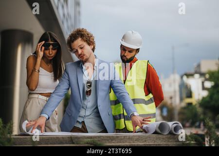 International Team of Architects Collaborating on Construction Design Project Stock Photo