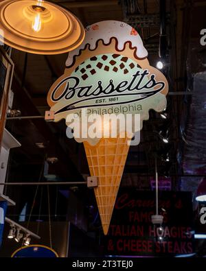 Philadelphia, PA – US – Oct 14, 2023 The hanging sign for Bassetts in the historic Reading Terminal Market, an enclosed public market located in Cente Stock Photo