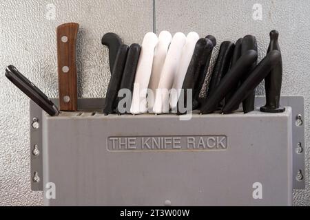 Isolated close up high resolution image of a knife rack in a butcher shop Stock Photo