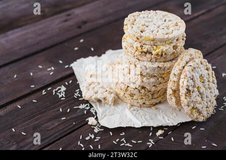 Pile puffed rice cakes brown wooden table Stock Photo